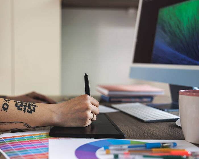 Designer revising creative work after early decisions required changes.