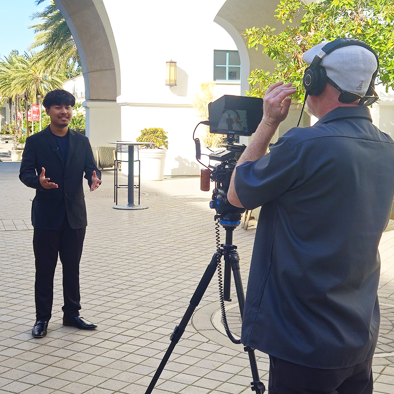 Behind the scenes during an on-location social media video production shoot at SDSU.