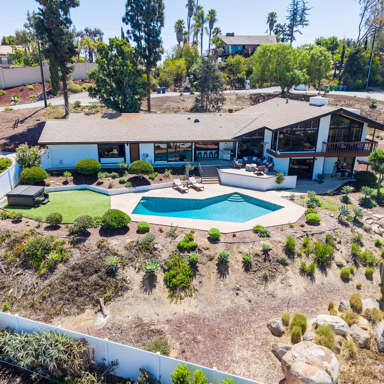 Aerial view of a home exterior and swimming pool in La Mesa near Mt. Helix.