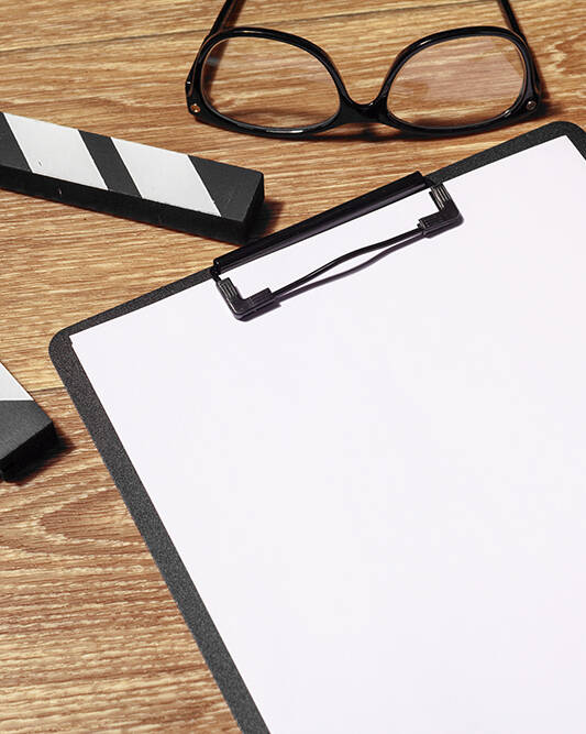 movie clapper and clipboard to write script